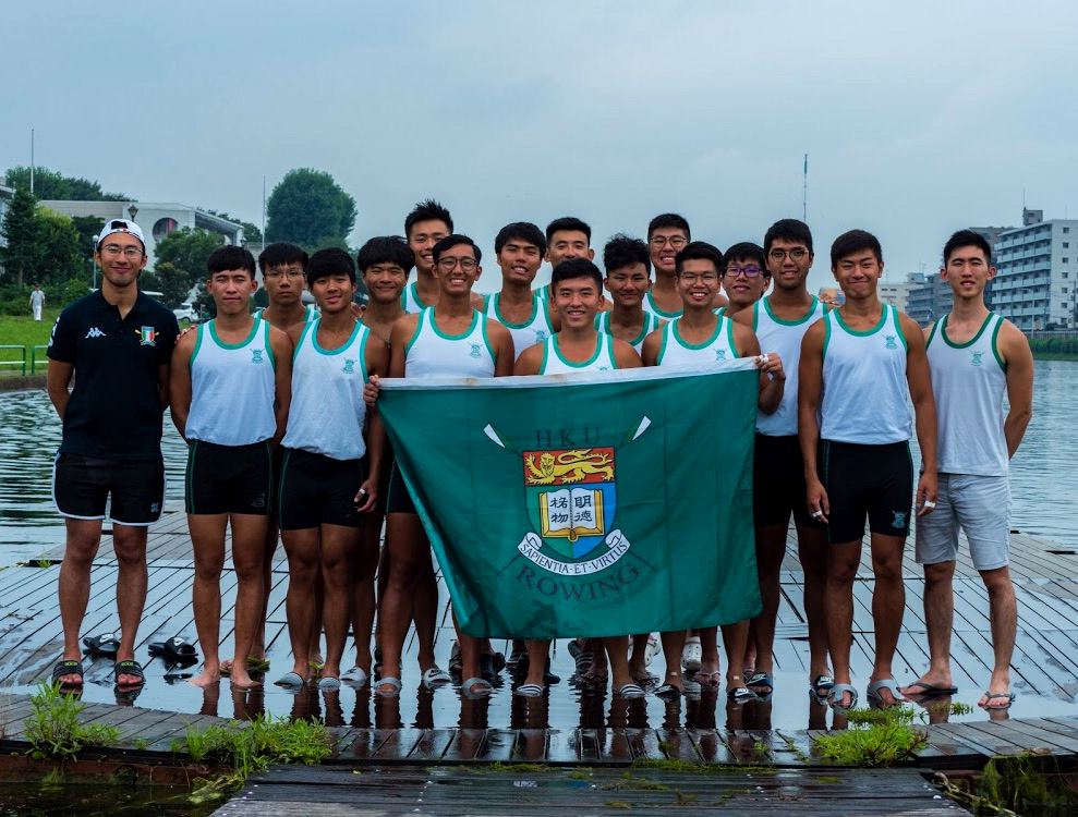 HKU rowing crew group photo by the water