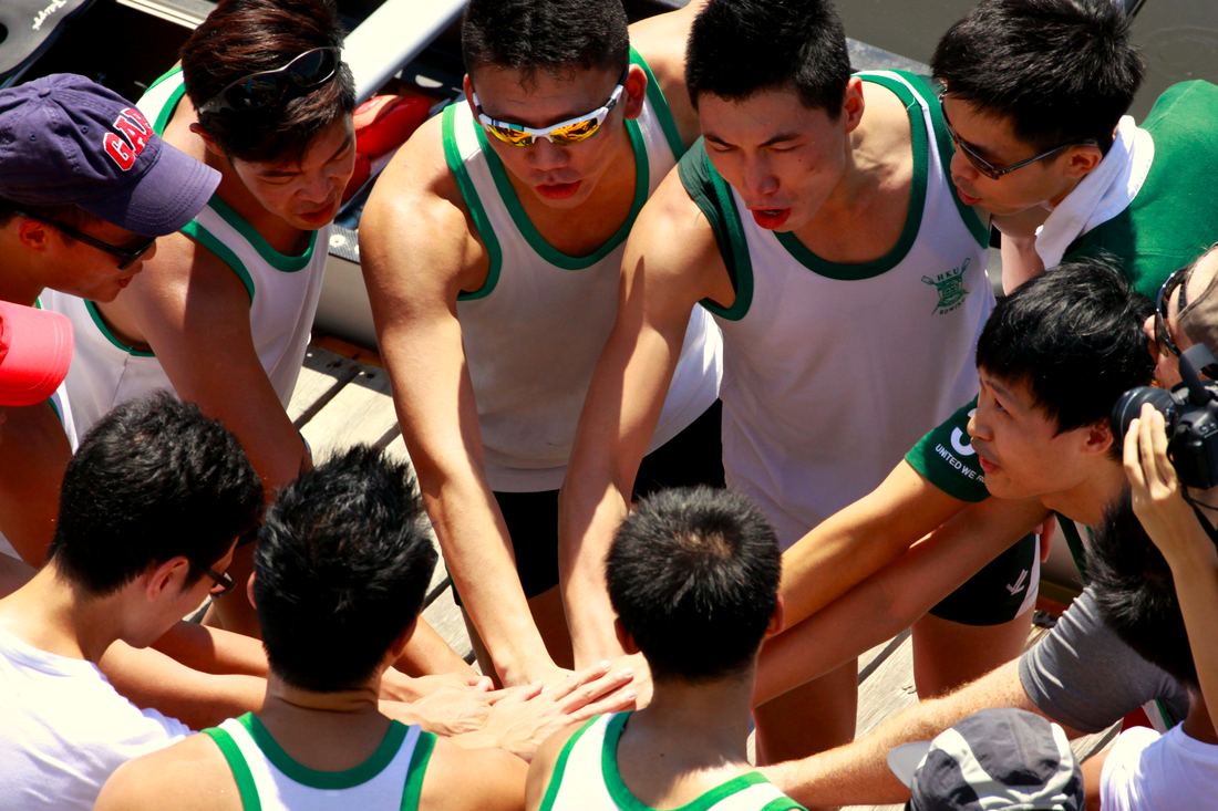 Crew huddled together before a race
