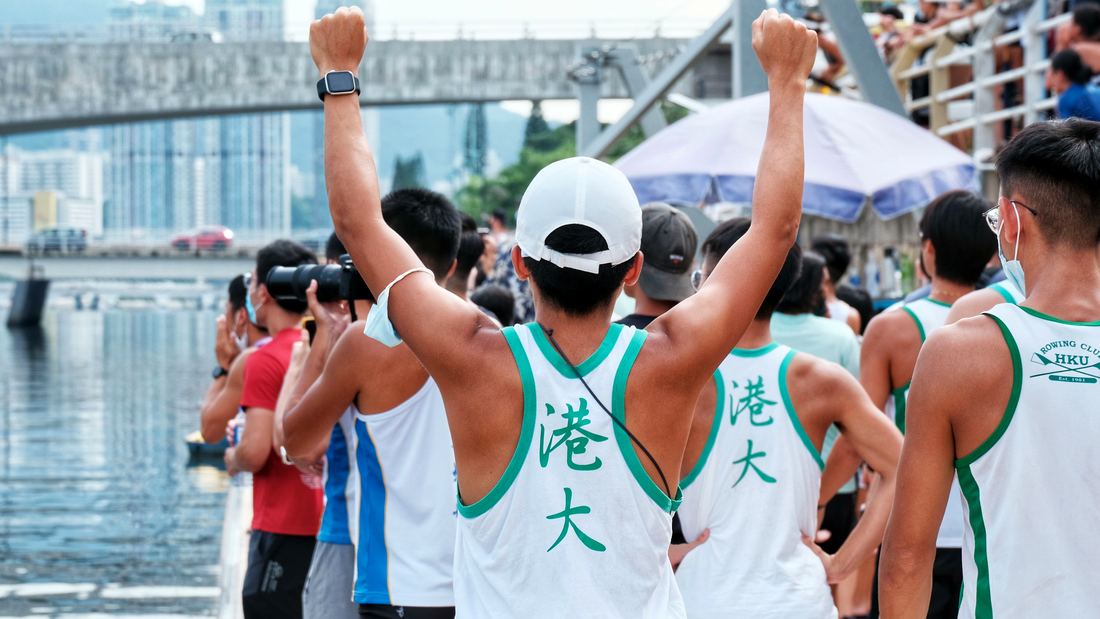Rowers celebrating with raised fists