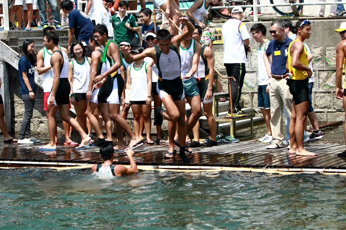 Team jumping into the water in celebration